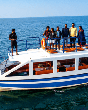 Exclusive private boat charter cruising along the scenic Chapora River in North Goa with SVS Chapora Cruise.