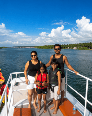 Couple posing for a romantic pre-wedding photoshoot on the upper deck of SVS Chapora cruise boat during golden sunset in Goa.